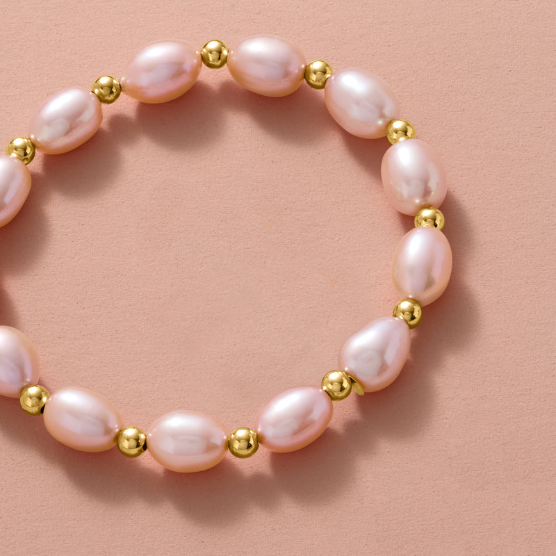 Pink pearl bracelet with round yellow gold spacer beads, stretch design
