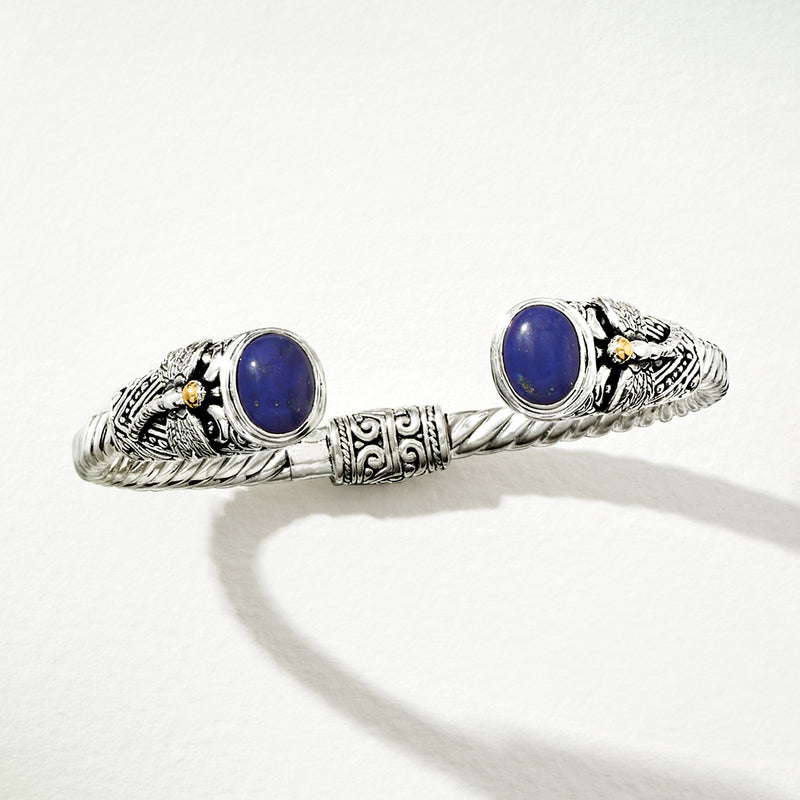 Sterling silver cuff bracelet with blue lapis cabochons and dragonfly-style motifs