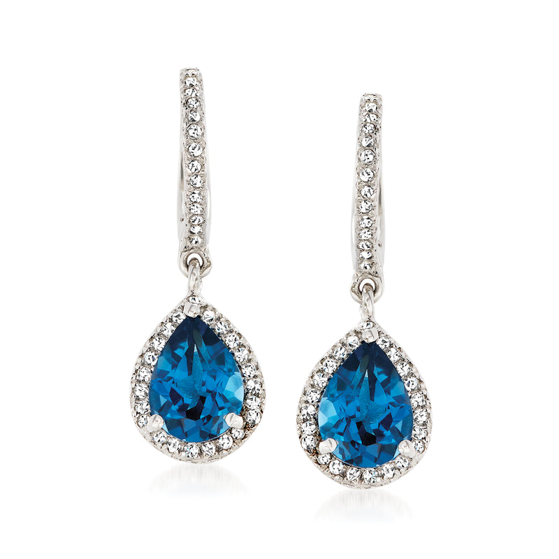 Sterling silver drop earrings with blue teardrop gemstones in sparkling halos