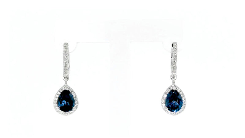 Sterling silver teardrop drop earrings with blue center stone and crystal border