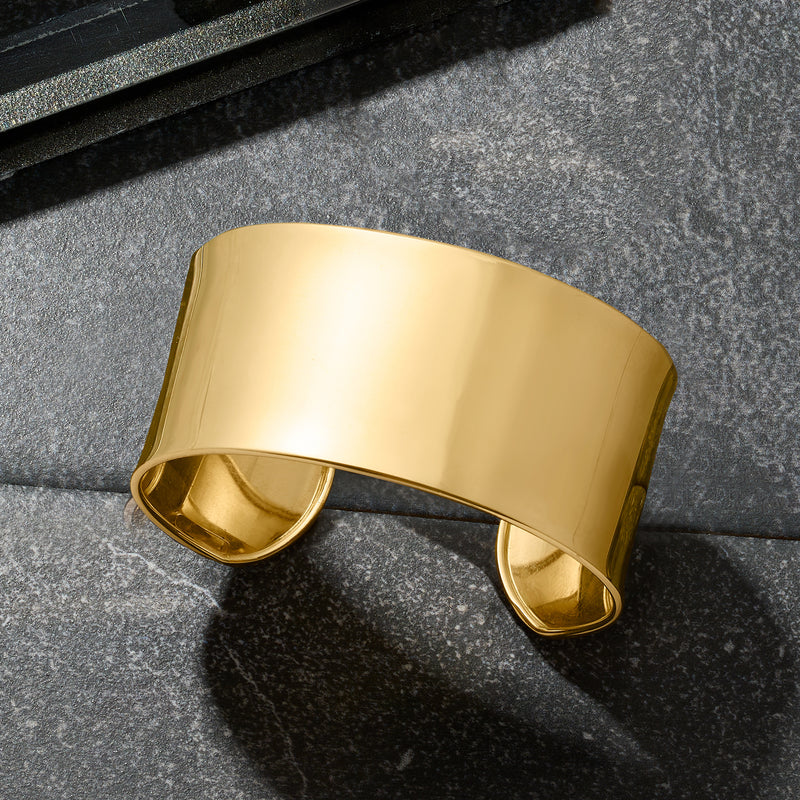 14kt yellow gold wide cuff bracelet, angled view of smooth polished open cuff