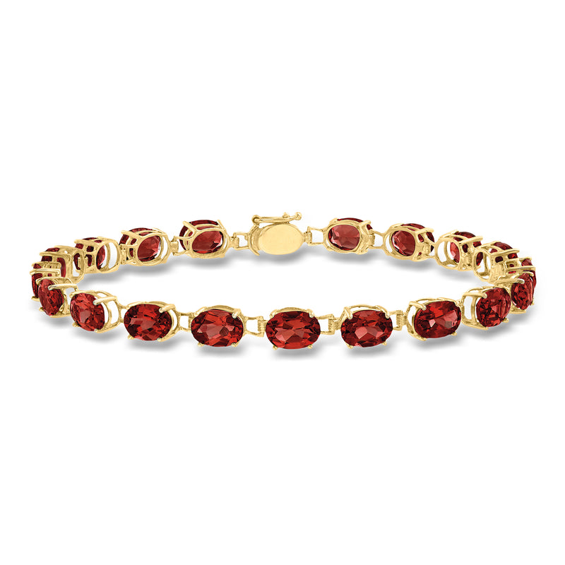 Oval garnet tennis bracelet in 14kt yellow gold with red oval gemstones