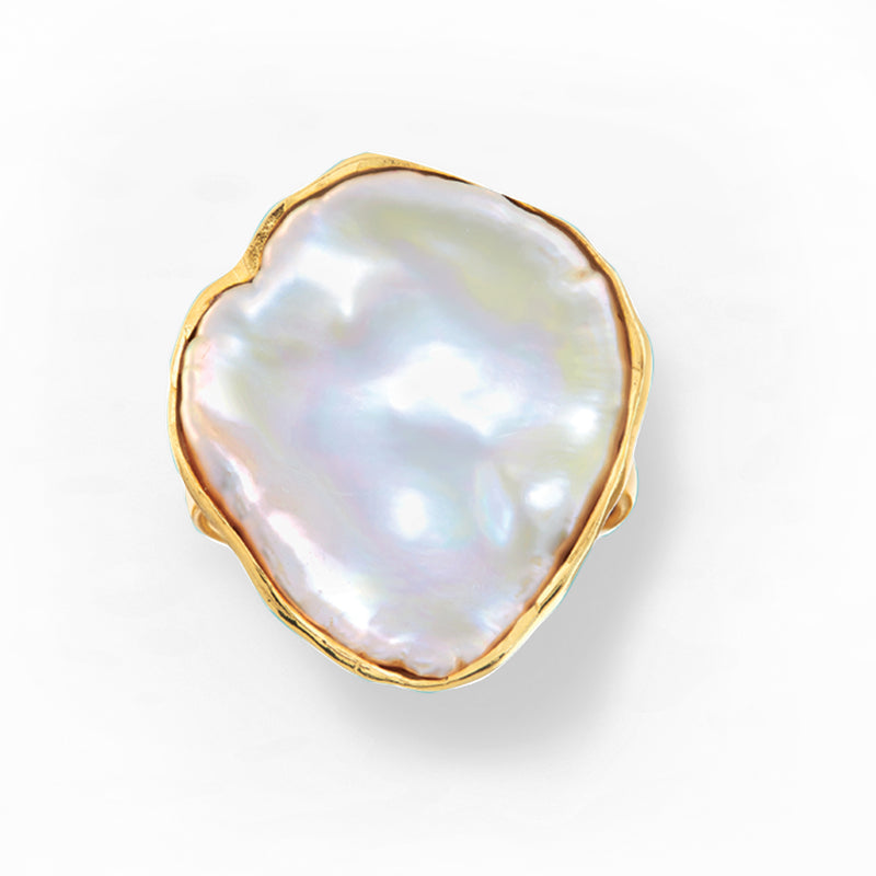 Gold over sterling ring featuring flat oval keshi pearl with lustrous iridescent sheen