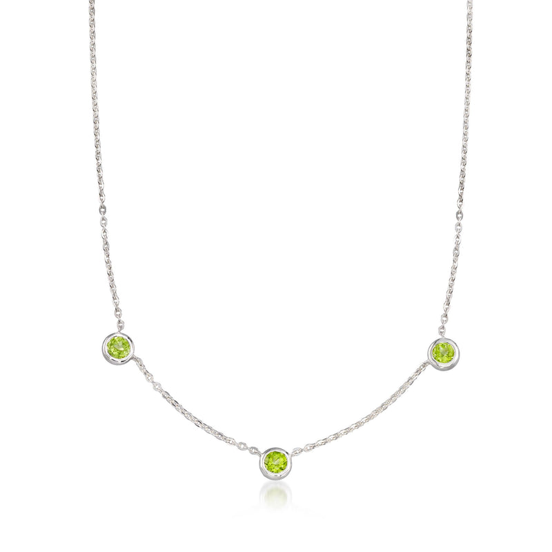 Sterling silver three-stone station necklace with three round peridot green gemstones