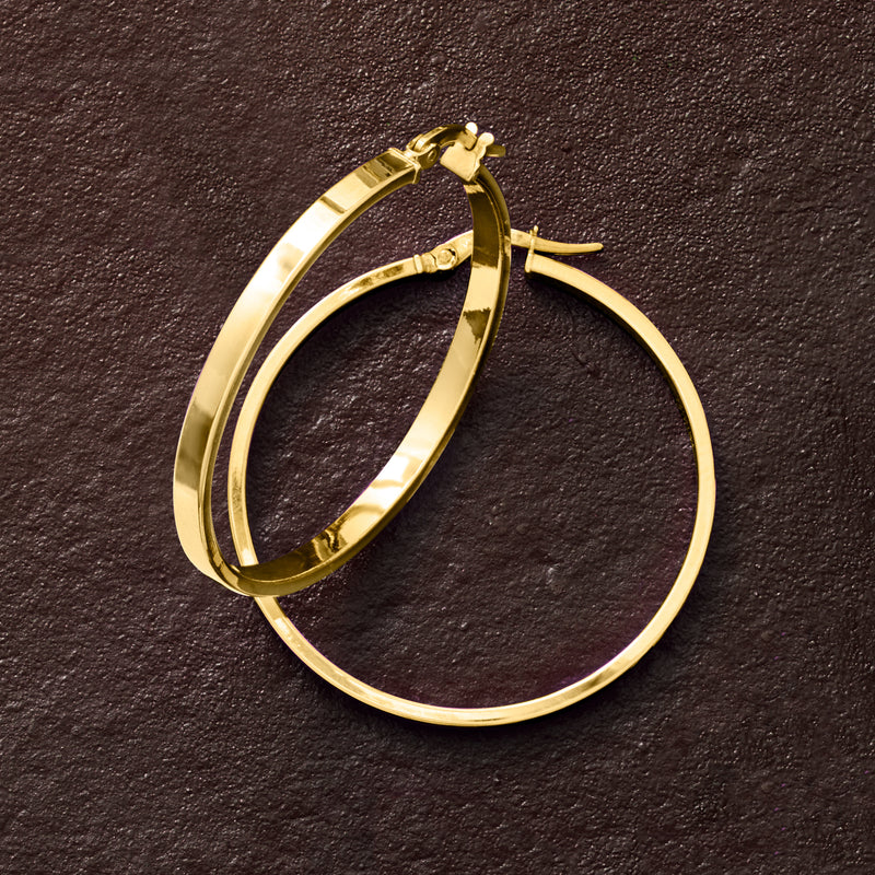Squared-edge yellow gold hoop earrings, angled view showing hinged clasp