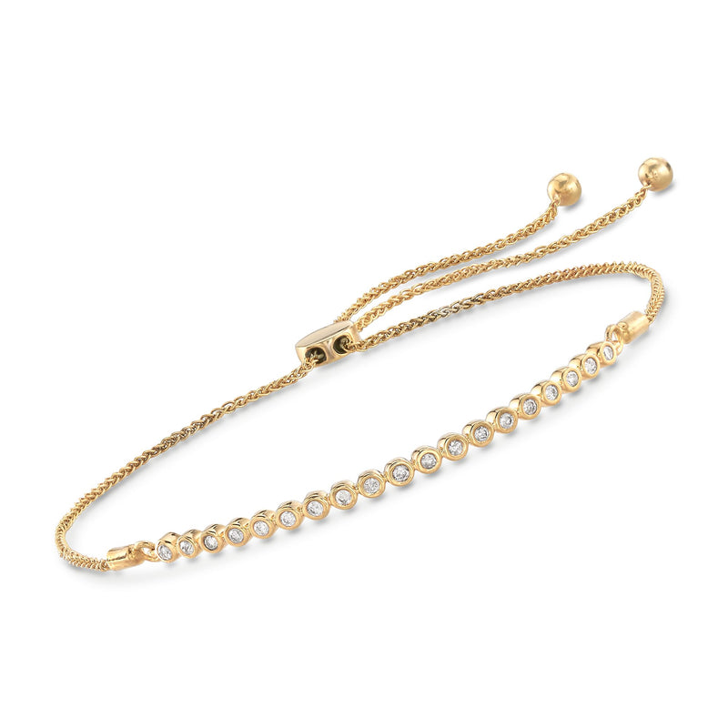 Gold bolo bracelet with bezel-set round diamonds and braided chain, adjustable ends