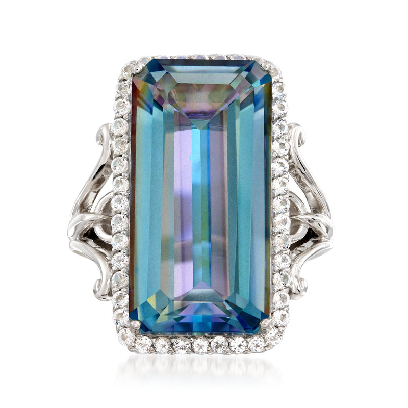 Sterling silver ring with large rectangular blue gemstone and halo of white stones