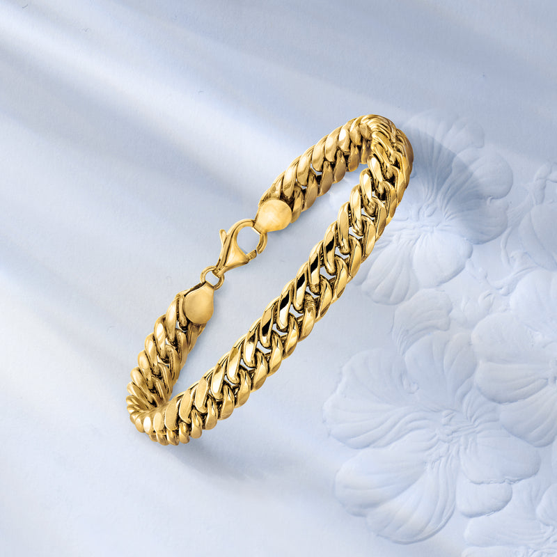 18kt yellow-gold Cuban-link bracelet with box clasp, laid out for close view
