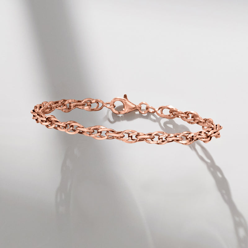 Rose gold double-oval link bracelet with lobster clasp and polished finish