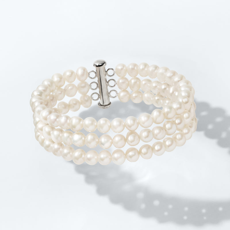 Cultured pearl three-strand bracelet with sterling silver clasp and white round pearls