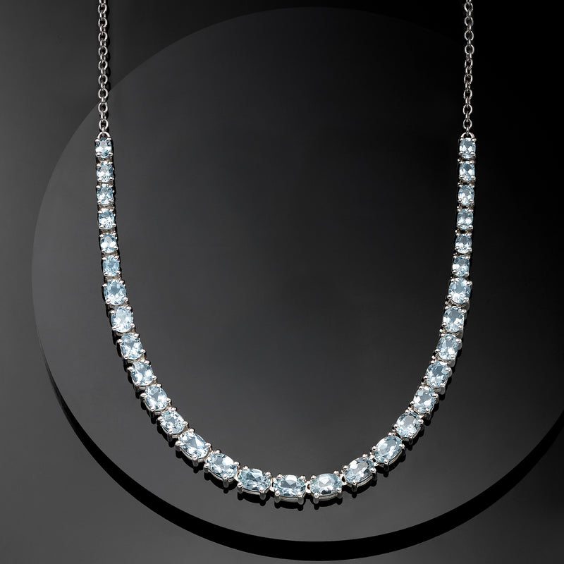 Graduated aquamarine gemstone necklace in sterling silver with light-blue stone clusters