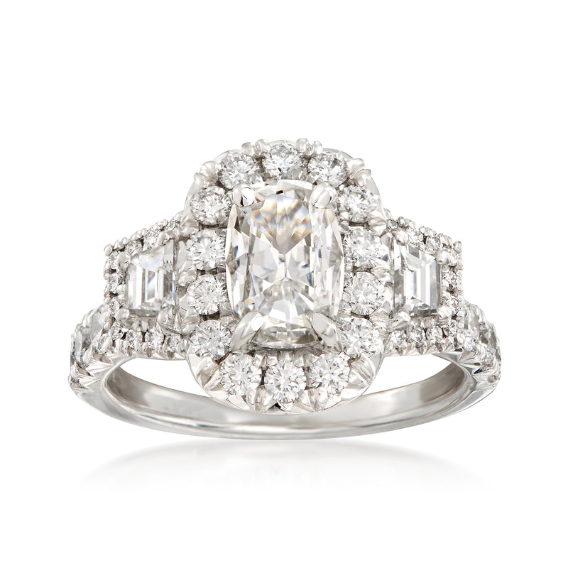 18kt white gold engagement ring with center emerald-cut diamond and halo accents