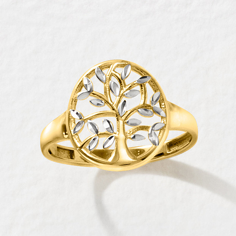 Two-tone gold Tree of Life cut-out ring with round top and white sculpted leaves