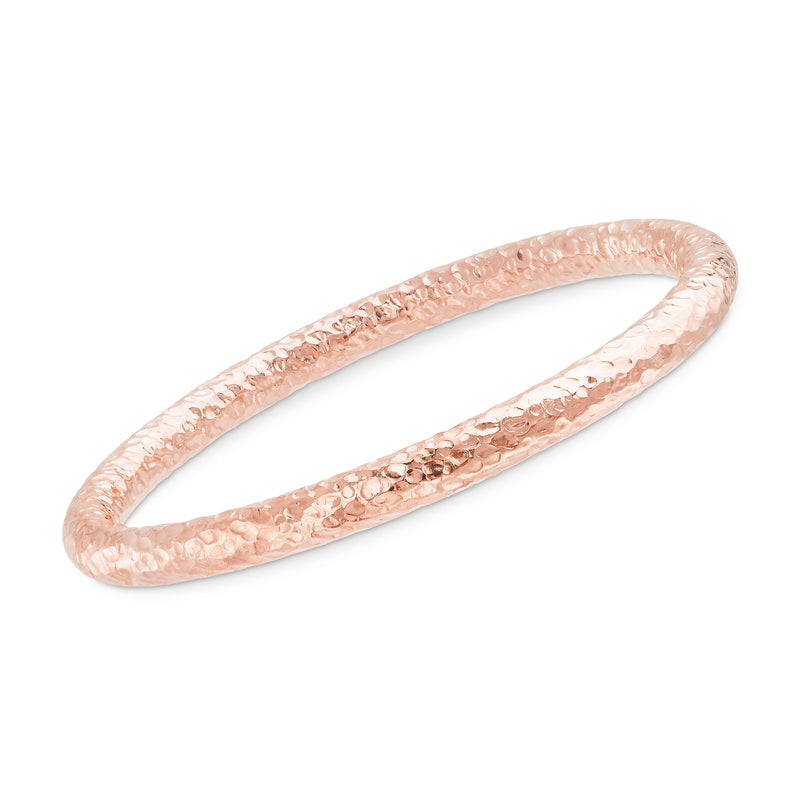 Rose gold hammered bangle bracelet with smooth open ends and oval shape