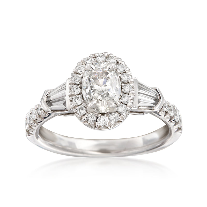 White gold diamond halo engagement ring with oval center stone and side baguettes