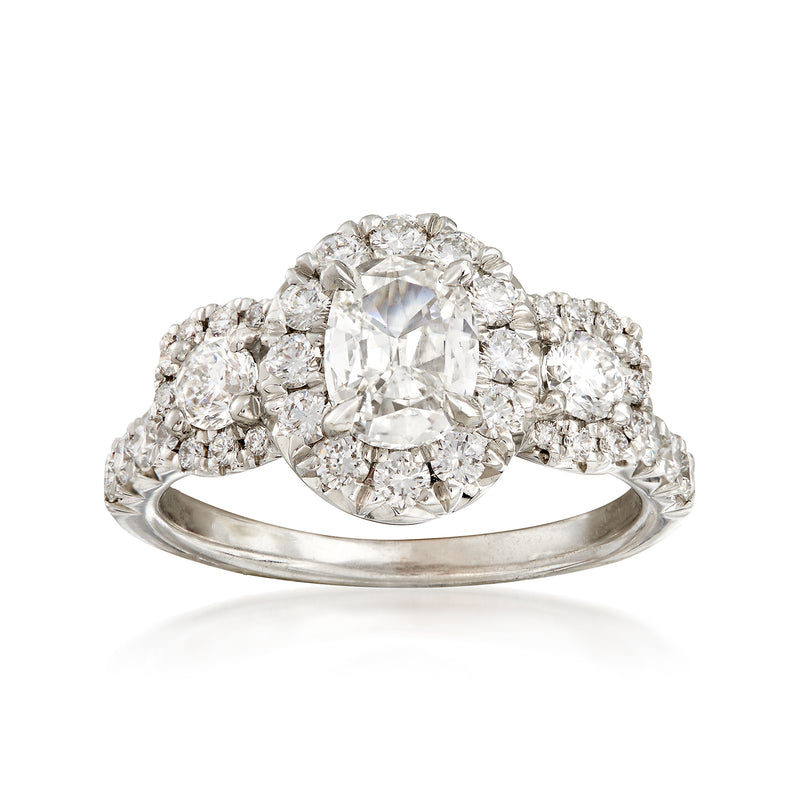 18kt white gold diamond engagement ring with oval center stone and halo of round diamonds