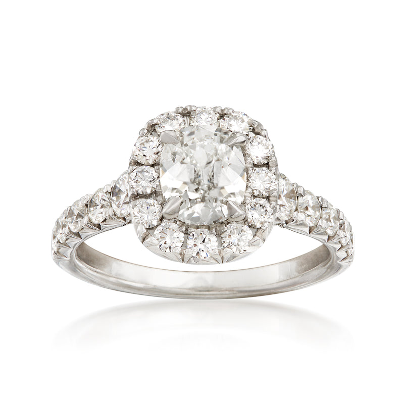 18kt white gold diamond engagement ring with large center stone and side halo accents
