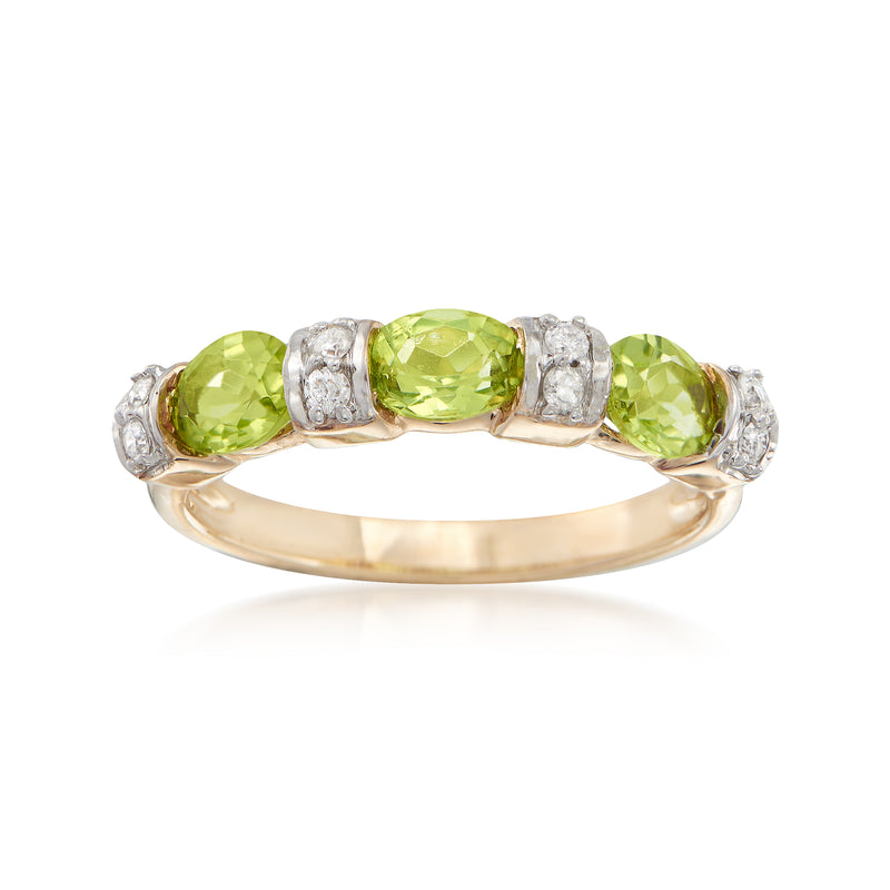 14k yellow gold ring with three green peridots and diamond accents, oval center stone