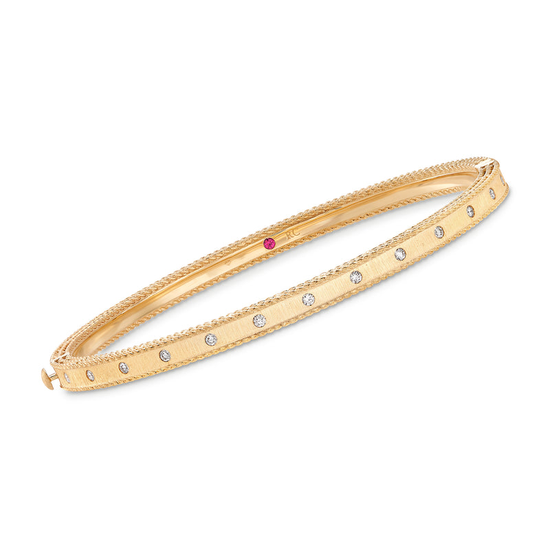 18kt yellow gold bangle bracelet with round diamond accents and a purple center gem