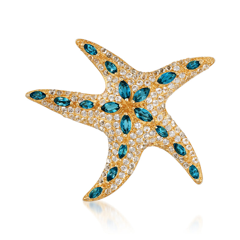 Starfish pin with blue and white topaz in gold over sterling