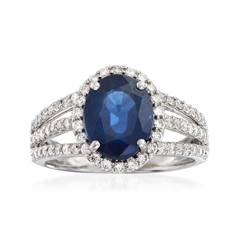 Oval sapphire ring in white gold with diamond halo and triple-shank side accents