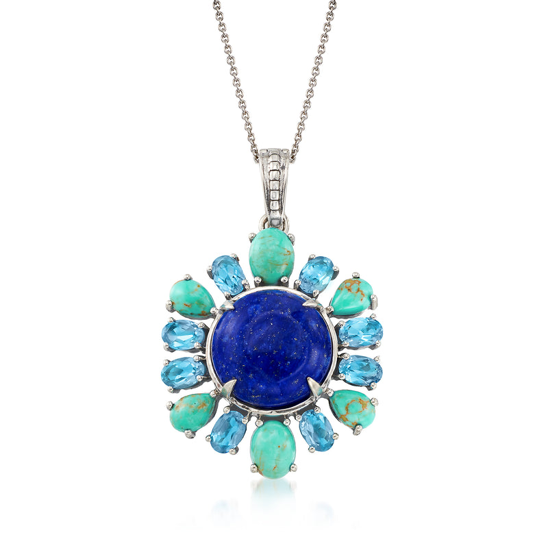 Sterling silver pendant necklace with round blue gemstone center and blue/green stones
