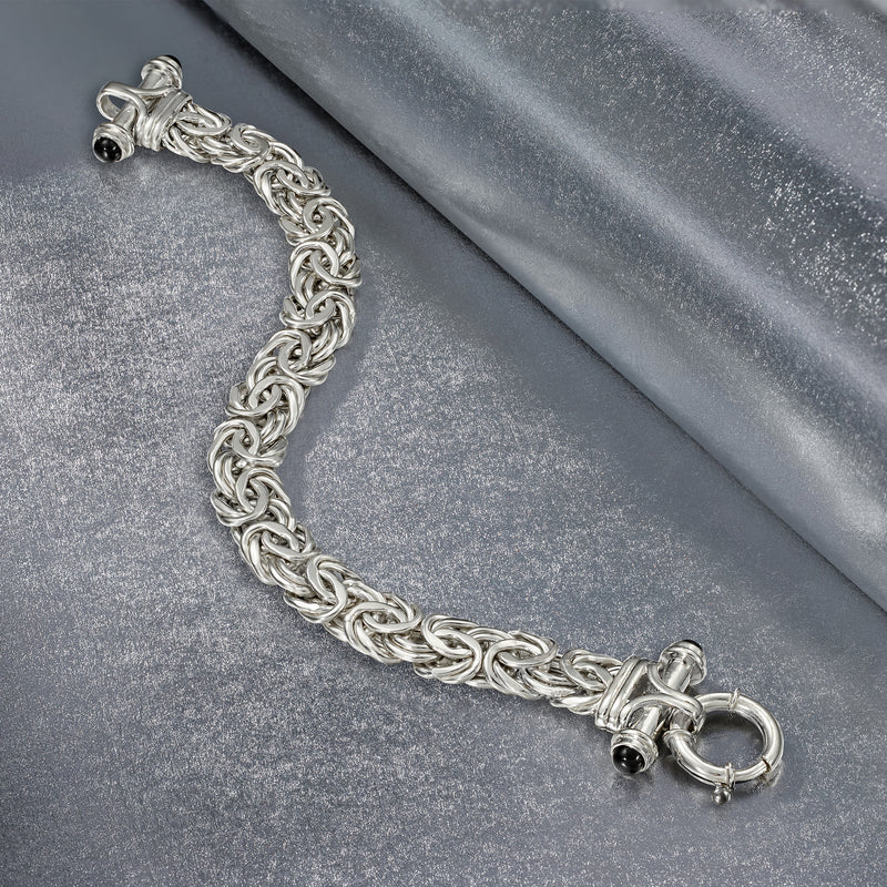 Sterling silver chain bracelet with black onyx accents and ring clasp