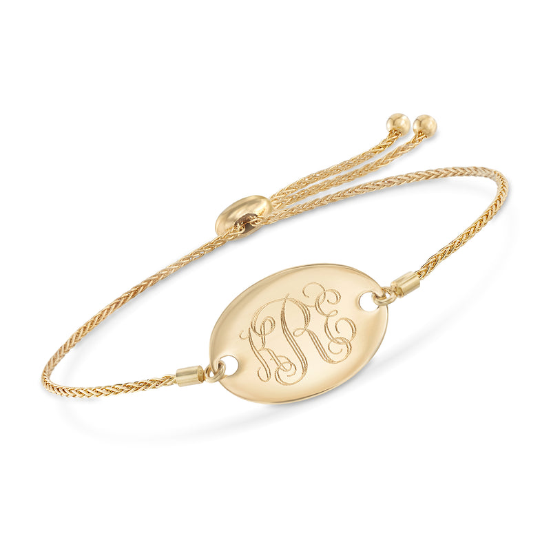 14kt yellow gold bolo bracelet with engraved oval monogram charm