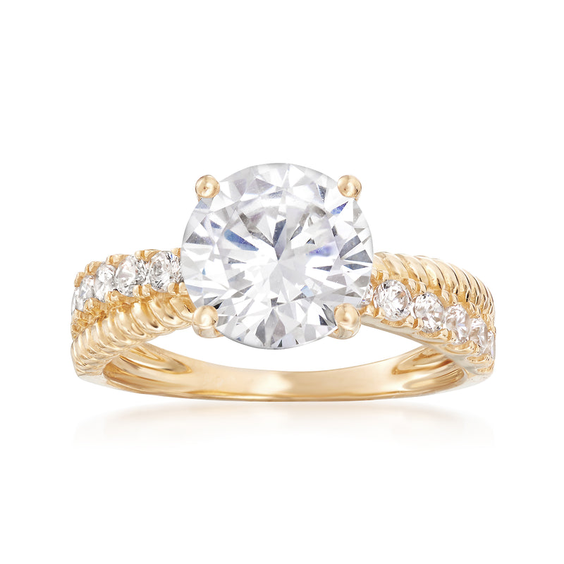 Yellow gold CZ criss-cross ring with large round clear center stone and side stones