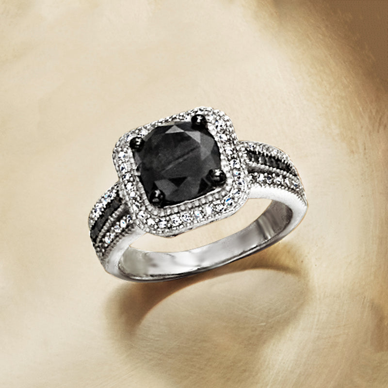 Sterling silver ring with black cushion center stone, white diamond halo, slim band