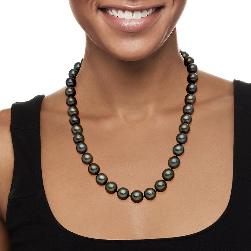 Black Tahitian pearl necklace with round beads, layered look at neckline