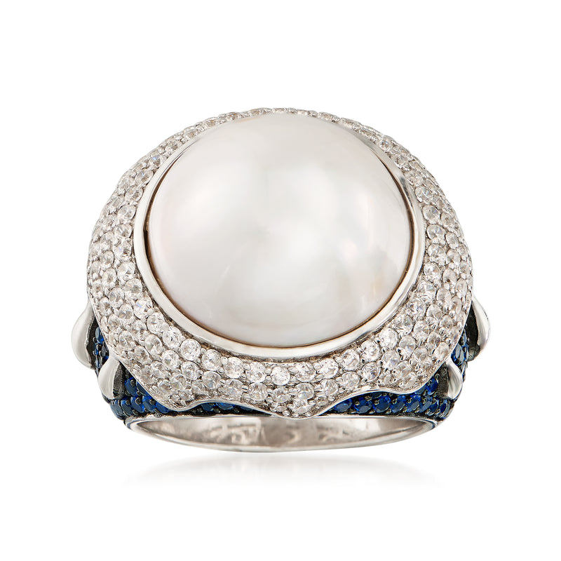 Sterling silver ring with 16mm mabe pearl, CZ halo, and blue spinel accents