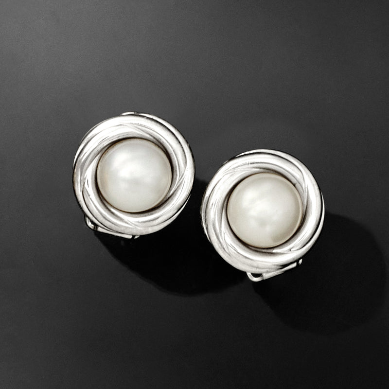 Sterling silver clip-on earrings featuring 8mm white cultured pearls in twisted rings