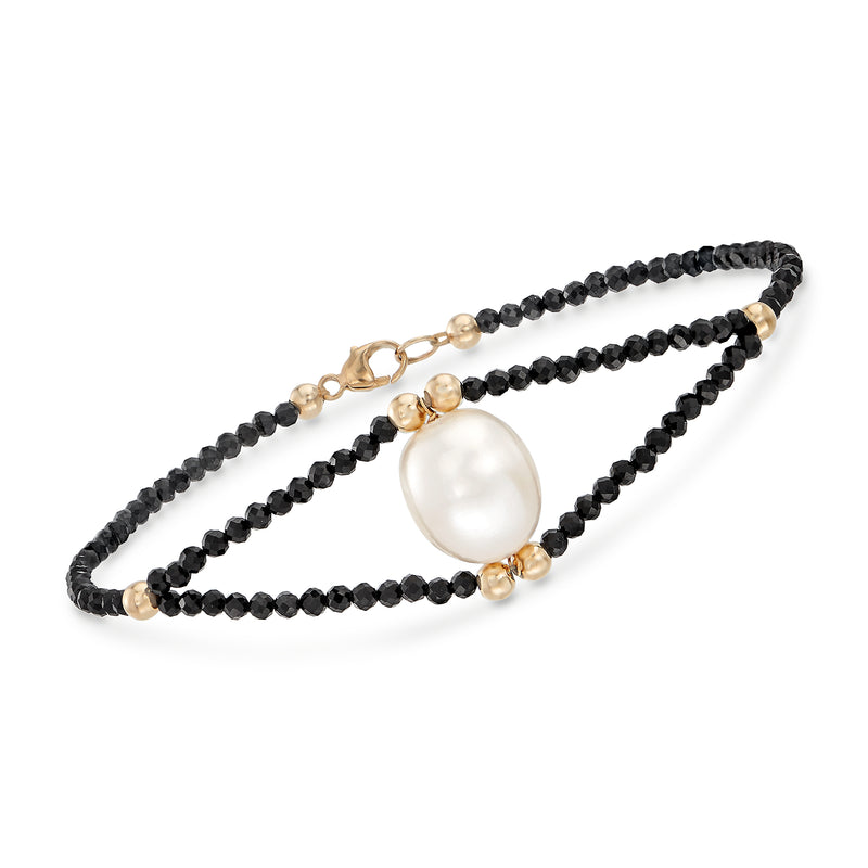14kt yellow gold bracelet with black spinel bead strands and a white cultured pearl drop