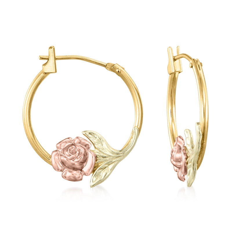 Two-tone gold floral hoop earrings with pink rose and green leaf charm, cross accent.
