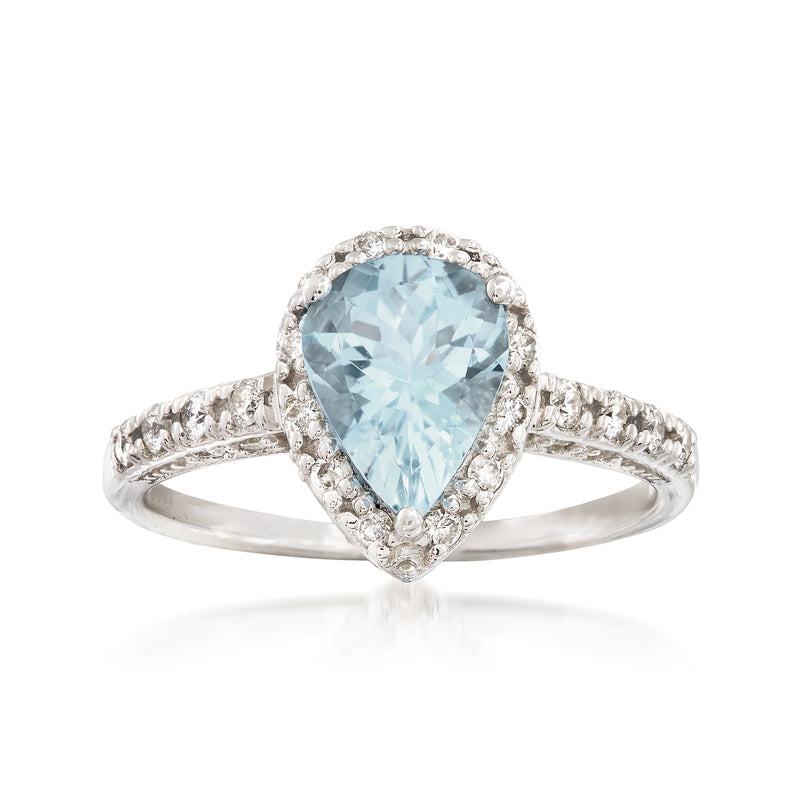 14kt white gold oval aquamarine ring with diamond halo and split shank