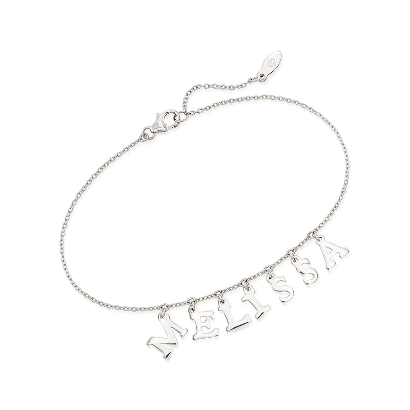 Sterling silver letter-charm bracelet with small dangling charms spelling “MEL”