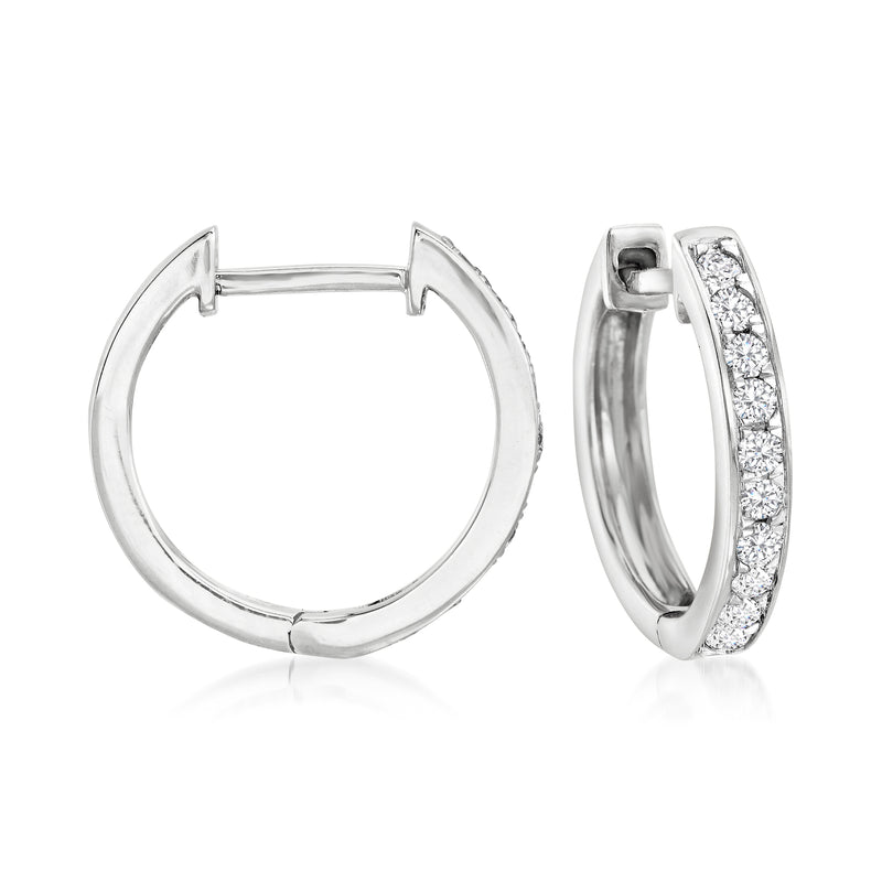 Diamond huggie hoop earrings in 14kt white gold, one with pavé diamonds
