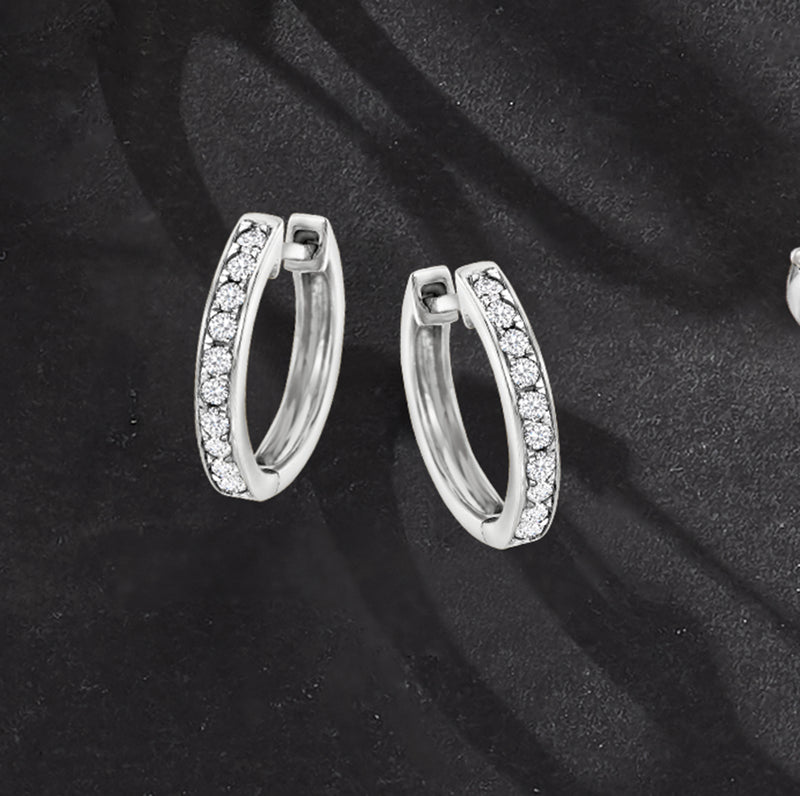 Diamond huggie hoop earrings in 14kt white gold with pavé front