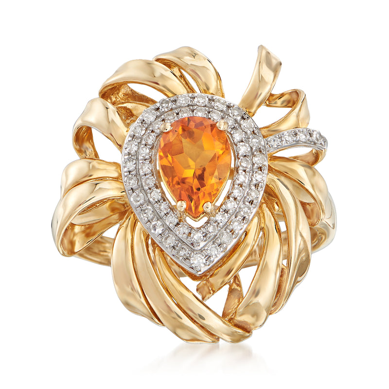 14kt yellow gold ring with oval orange citrine, diamond halo and sculpted flower prongs