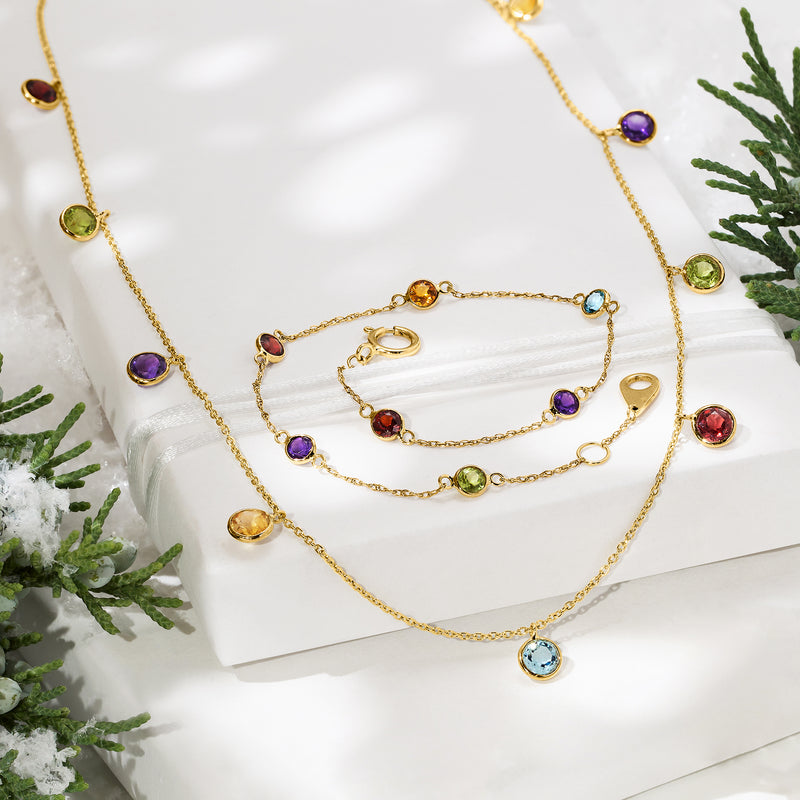 14kt yellow gold station necklace with multicolor round bezel-set gems along chain