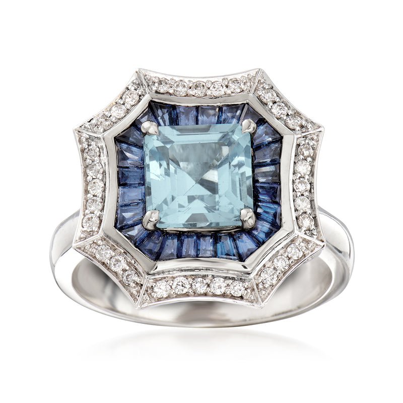 14kt white gold ring with square light-blue center gemstone, sapphire-like side stones, diamond halo