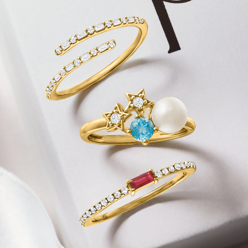 14kt yellow gold bypass ring with baguette-cut diamonds set across the top