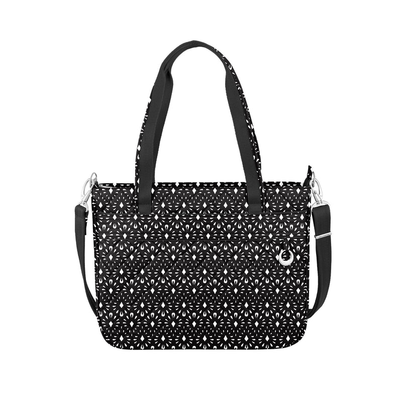 Travelon tote bag with black and white geometric shell pattern, top handles and crossbody strap