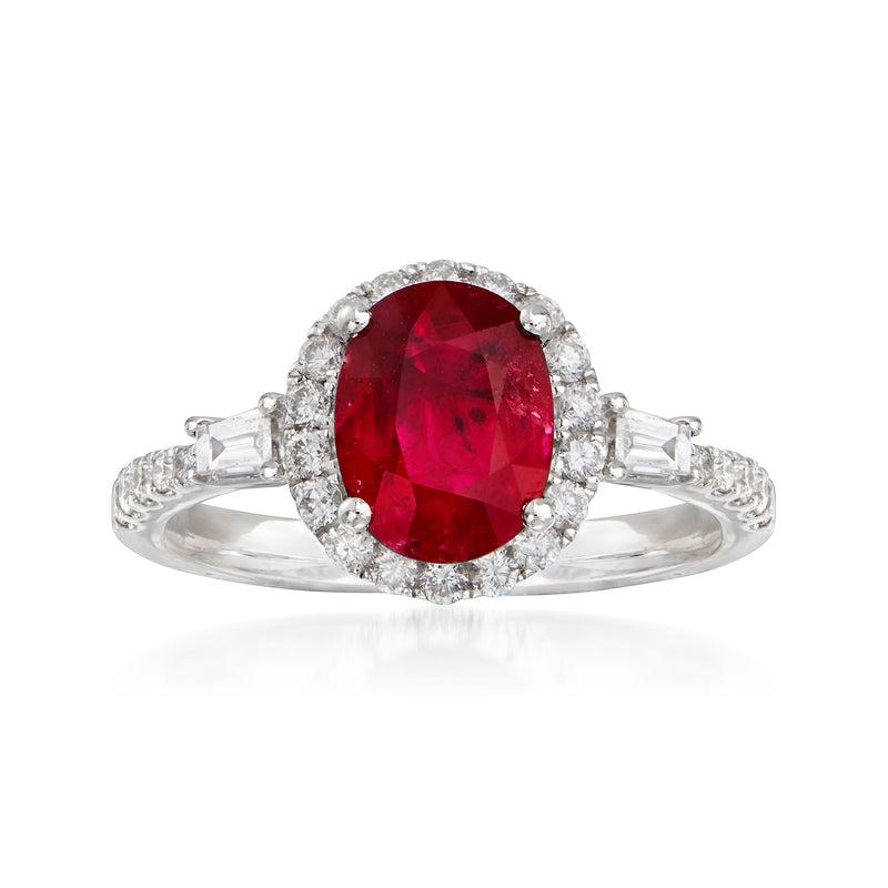 18kt white gold ring with oval red ruby center, diamond halo and baguette side stones