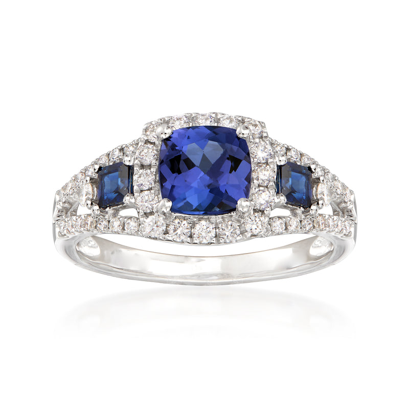 14kt white gold ring with oval blue tanzanite, diamond halo and blue side stones