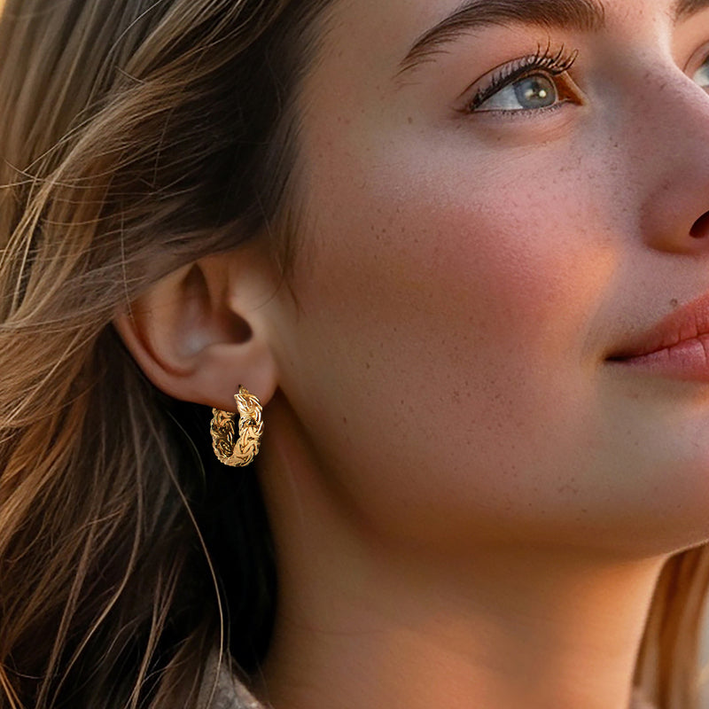 Yellow gold Byzantine hoop earrings on model, close-up of braided texture