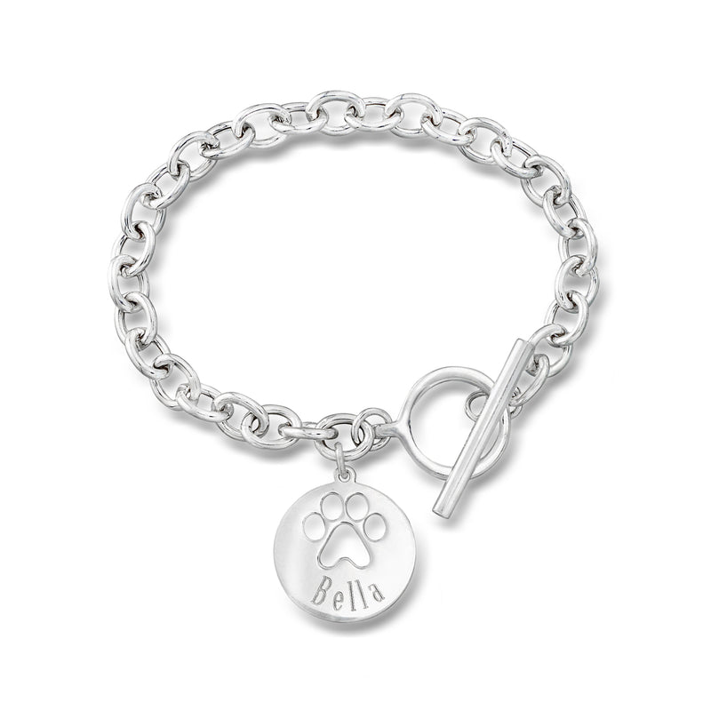 Sterling silver paw-print charm bracelet with round charm engraved Bella