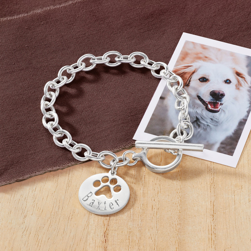 Sterling silver chain bracelet with round paw-print charm and bar clasp