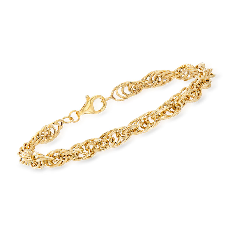 Yellow gold multi-link rope bracelet with twisted chain links and oval clasp